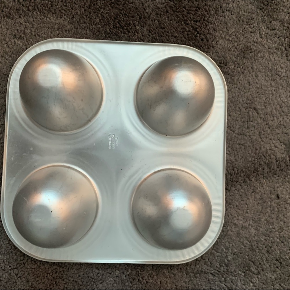 Wilton Vintage 4-cavity Mini Doll Dress cake pan.  Good used condition.